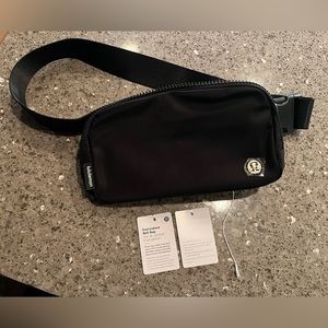 Black/gold lululemon belt bag